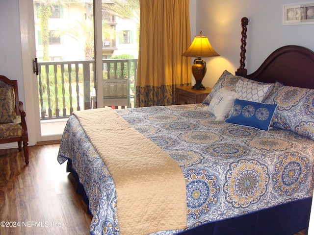 bedroom with hardwood / wood-style flooring