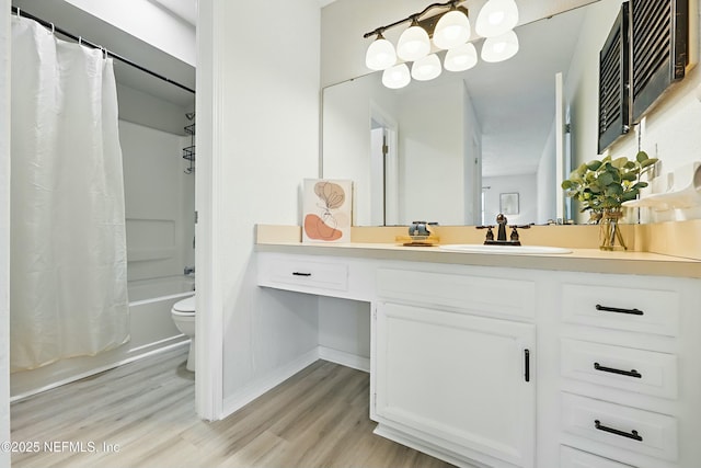 11657 Tanager Dr, Jacksonville, FL 32225 - bathroom featuring vanity, shower / bathtub combination with curtain, wood finished floors, baseboards, and toilet