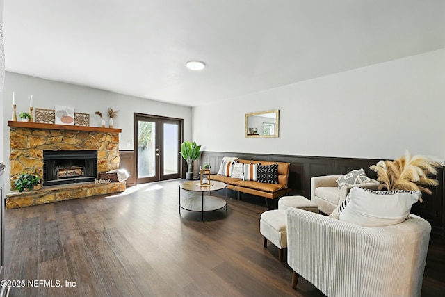 11657 Tanager Dr, Jacksonville, FL 32225 - living area with a wainscoted wall, wood finished floors, and a fireplace
