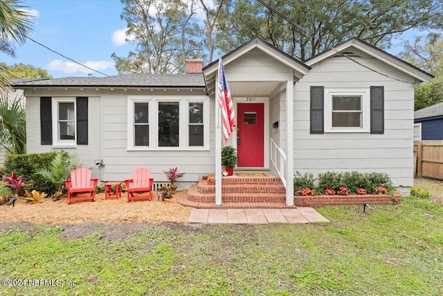 bungalow with a front yard