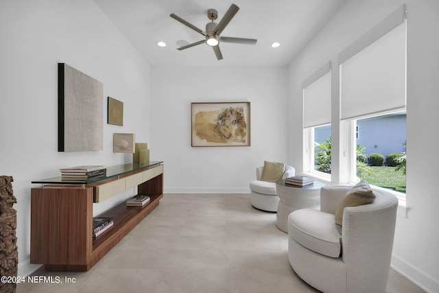 sitting room featuring ceiling fan