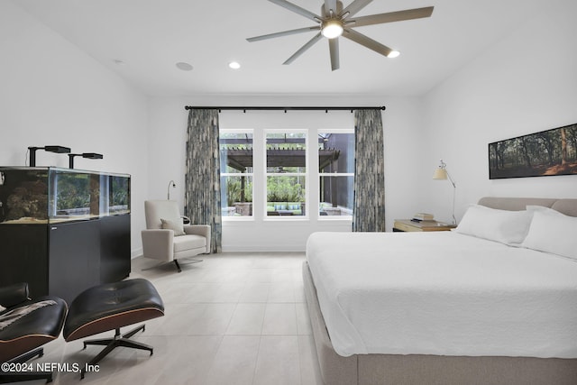 bedroom with ceiling fan and light tile patterned flooring