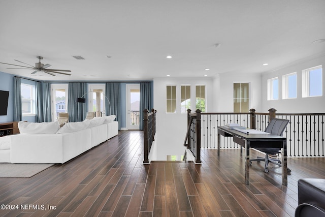 living room with dark hardwood / wood-style floors and ceiling fan