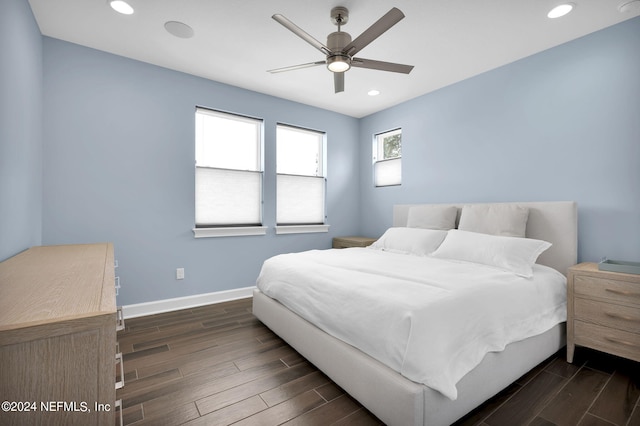 bedroom featuring ceiling fan and dark hardwood / wood-style flooring