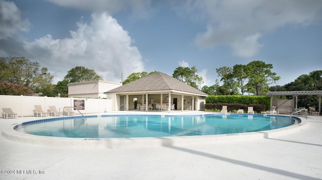 view of swimming pool featuring a patio area