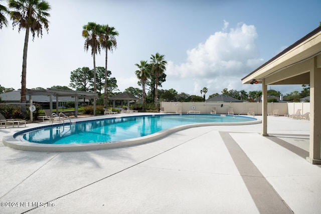 view of swimming pool featuring a patio