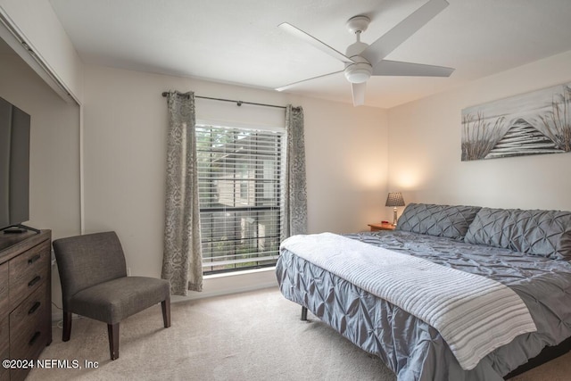 bedroom featuring ceiling fan and carpet floors