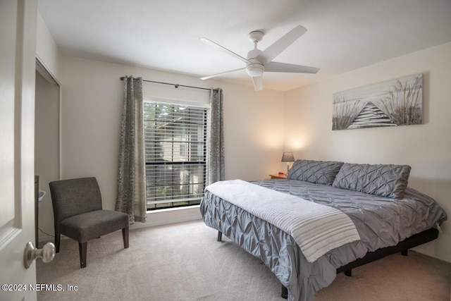 carpeted bedroom with ceiling fan