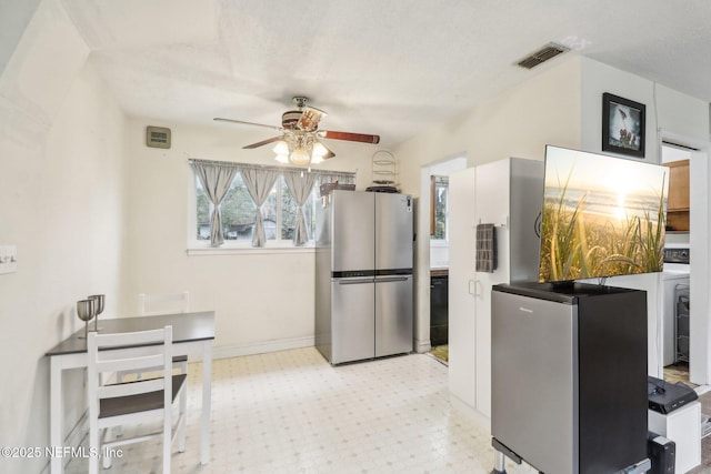 kitchen featuring stainless steel fridge, refrigerator, and ceiling fan