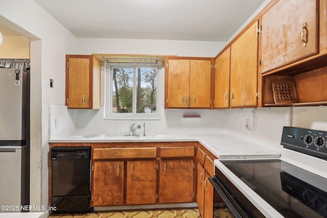 kitchen with sink and black appliances