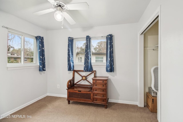 bedroom featuring light carpet, a closet, and ceiling fan