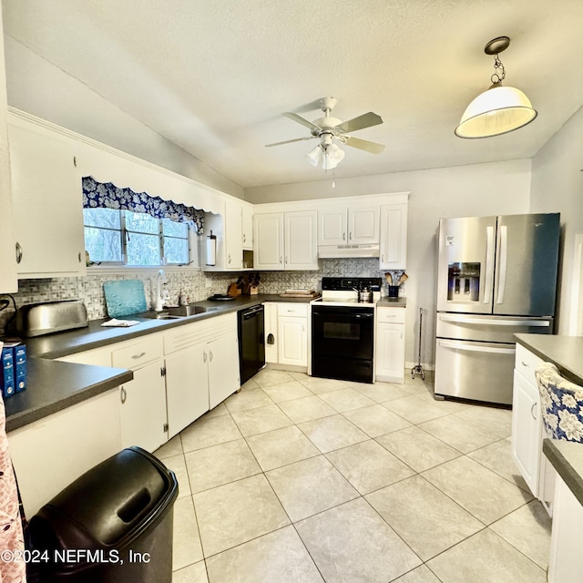 kitchen with ceiling fan, sink, black appliances, white cabinetry, and hanging light fixtures