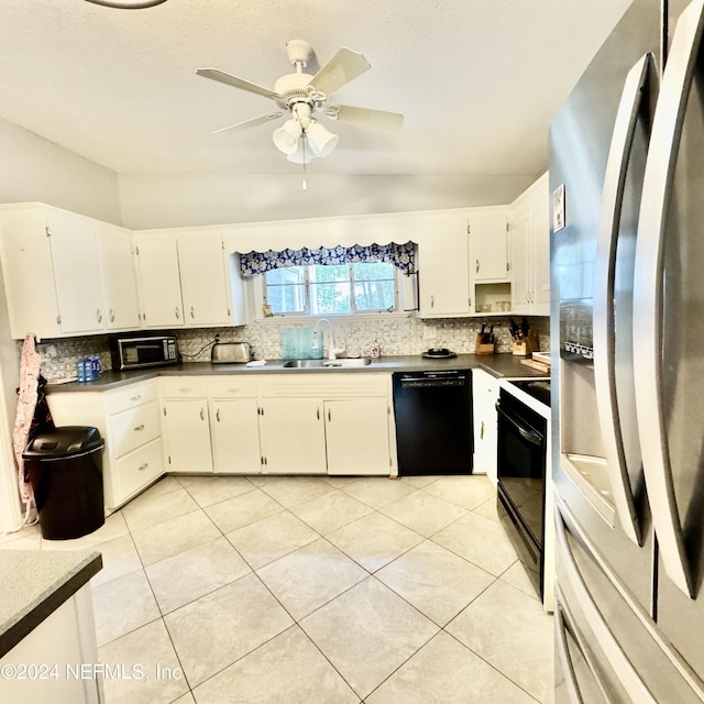 kitchen featuring light tile patterned flooring, sink, white cabinets, and black appliances