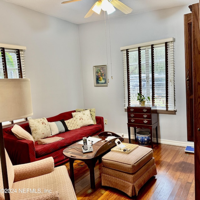 living room featuring ceiling fan, hardwood / wood-style floors, and a healthy amount of sunlight