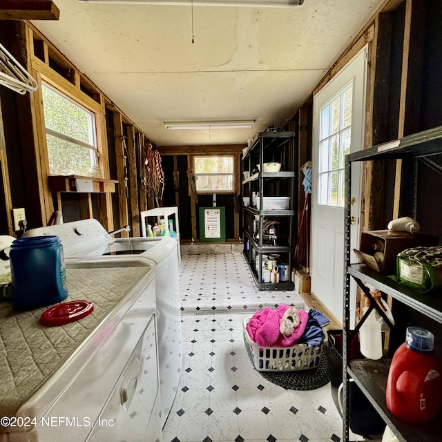 interior space with separate washer and dryer and plenty of natural light