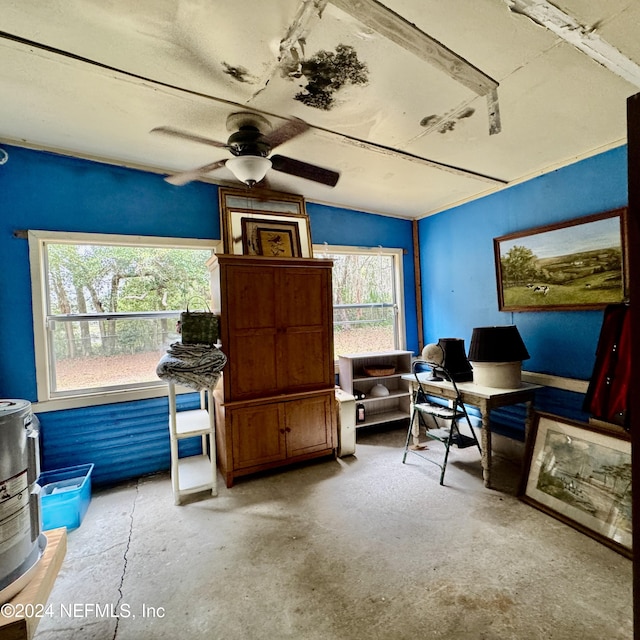 office space with ceiling fan, a wealth of natural light, and concrete floors