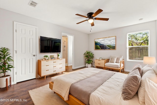 bedroom with ceiling fan and dark hardwood / wood-style flooring