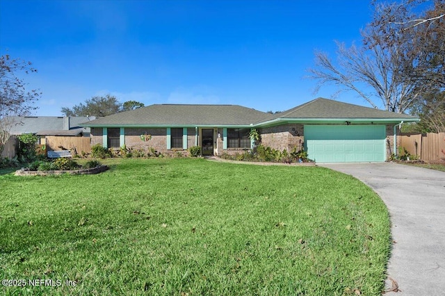 ranch-style house featuring a front yard and a garage