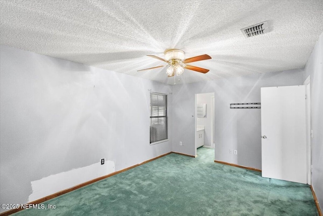 unfurnished bedroom with carpet flooring, ceiling fan, and a textured ceiling