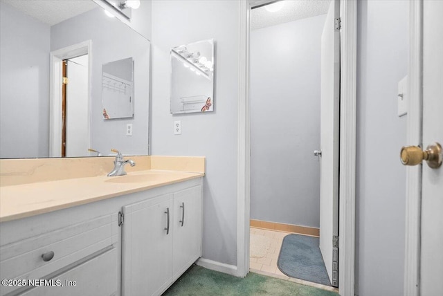 bathroom featuring vanity and a textured ceiling