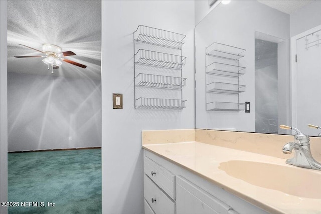 bathroom with vanity and a textured ceiling