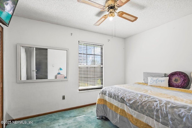 bedroom featuring carpet, a textured ceiling, and ceiling fan