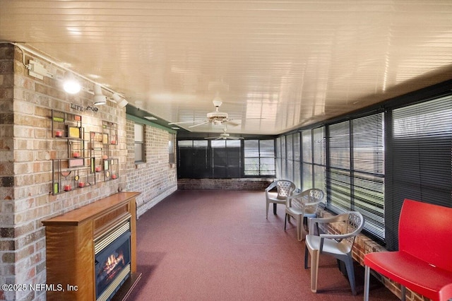 sunroom / solarium with ceiling fan