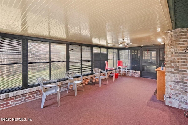 sunroom / solarium with ceiling fan