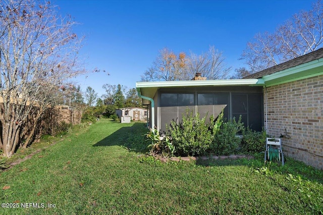 view of yard featuring a sunroom