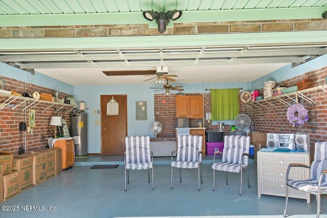 unfurnished dining area with ceiling fan, electric water heater, and brick wall