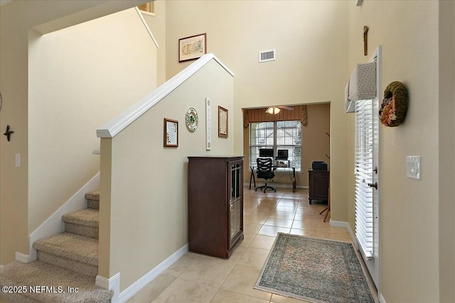 interior space with a towering ceiling