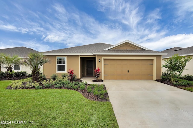 ranch-style home with a front yard and a garage