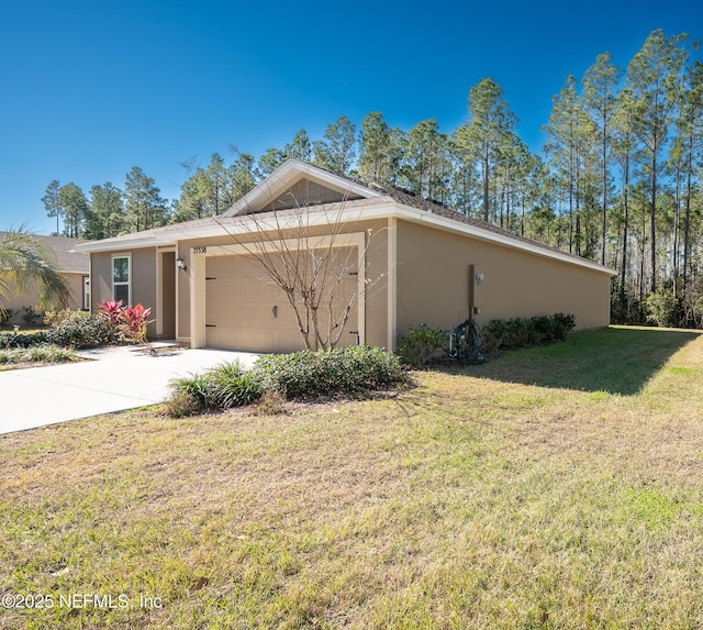 view of home's exterior featuring a lawn and a garage