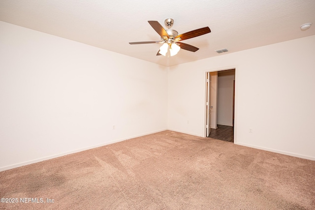 unfurnished room featuring ceiling fan and carpet floors