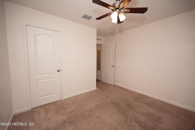 unfurnished bedroom with carpet floors and ceiling fan