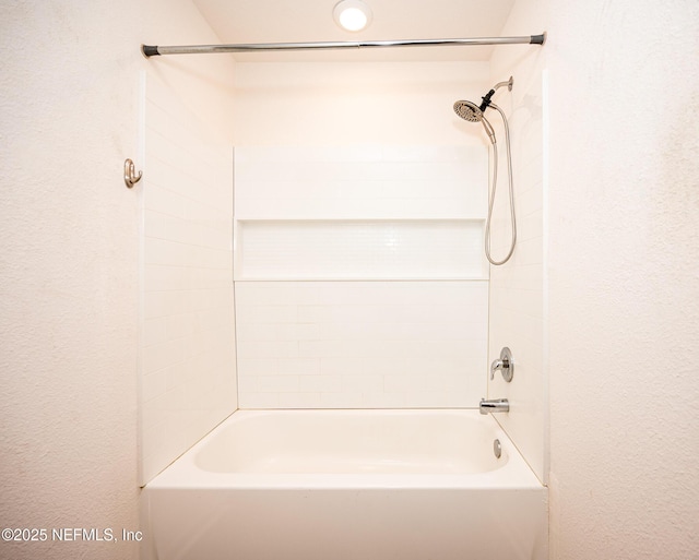 bathroom featuring  shower combination