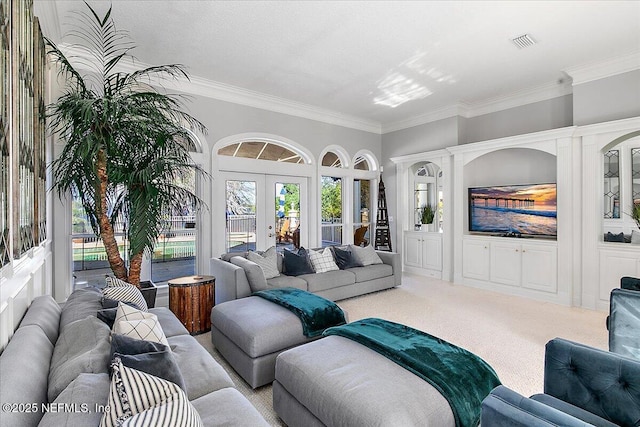 carpeted living room featuring french doors and crown molding