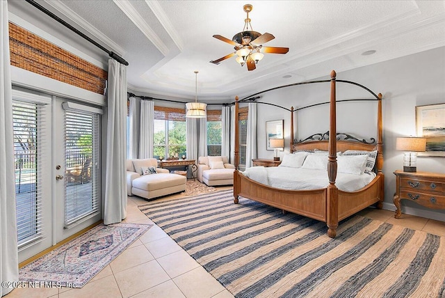 bedroom featuring ornamental molding, a textured ceiling, access to outside, a tray ceiling, and light tile patterned floors