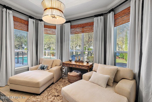 living area with plenty of natural light, light tile patterned floors, and ornamental molding