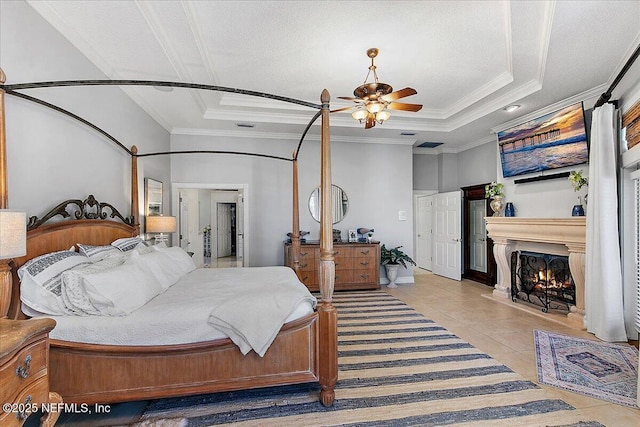 tiled bedroom with a raised ceiling, ceiling fan, and crown molding