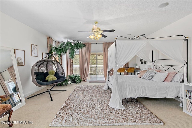 bedroom featuring access to outside, ceiling fan, light colored carpet, and a textured ceiling