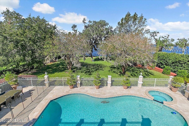 view of pool featuring an in ground hot tub and a patio