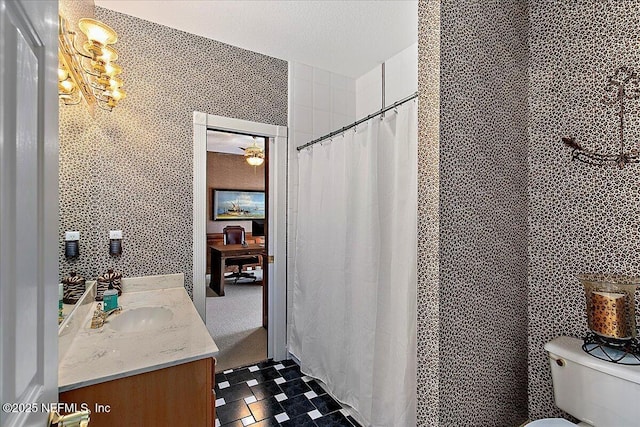 bathroom featuring vanity, a shower with shower curtain, and toilet