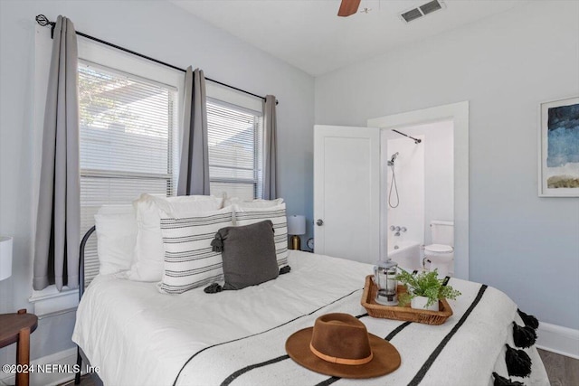 bedroom featuring multiple windows, wood-type flooring, and ceiling fan