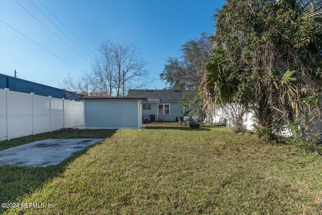 back of property featuring a patio and a lawn