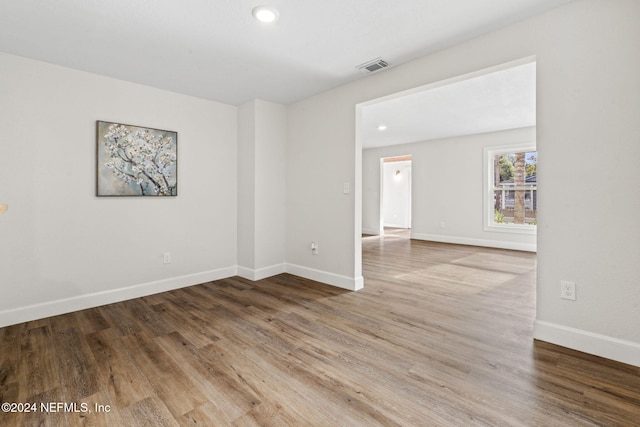 spare room with hardwood / wood-style flooring