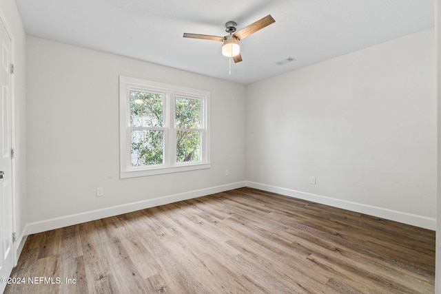 unfurnished room with ceiling fan and light hardwood / wood-style flooring