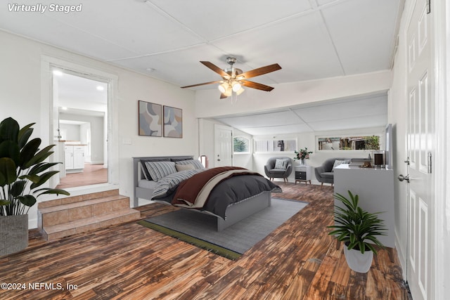 bedroom featuring hardwood / wood-style floors and ceiling fan