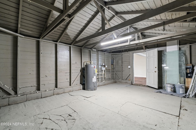 garage featuring a carport and water heater