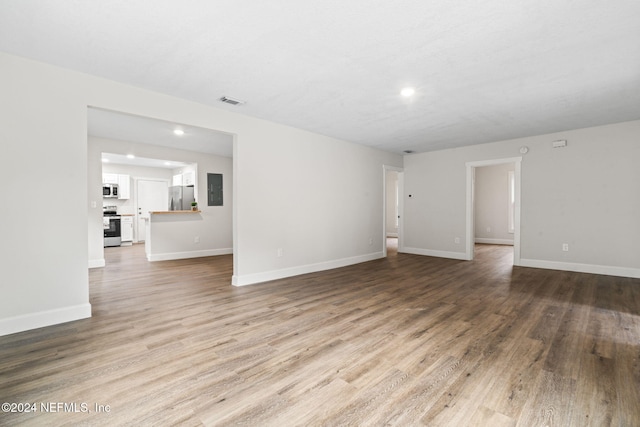 unfurnished living room featuring light wood-type flooring